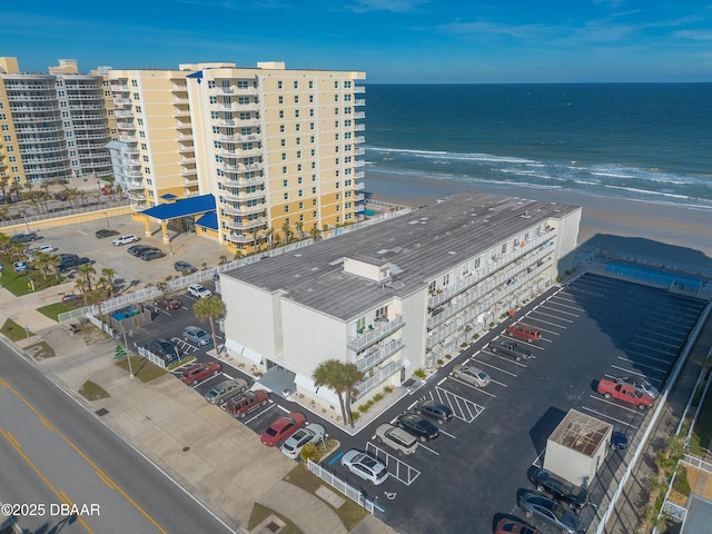 bird's eye view featuring a water view and a view of the beach