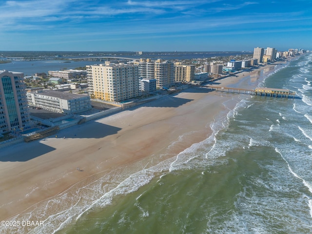 drone / aerial view with a view of the beach and a water view