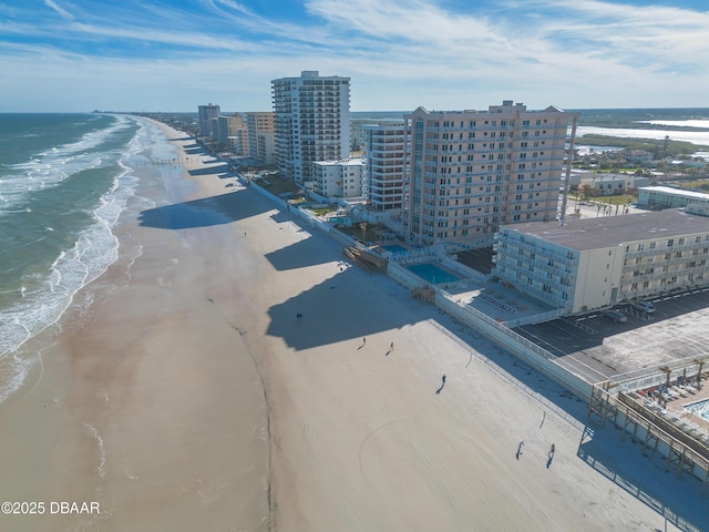 bird's eye view with a water view and a view of the beach