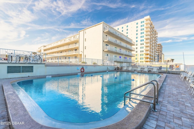 view of swimming pool with a patio