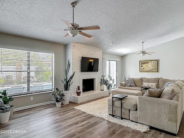 7 Heather Ln, Ormond Beach, FL 32174 - living room with a ceiling fan, a textured ceiling, healthy amount of natural light, wood finished floors, and lofted ceiling
