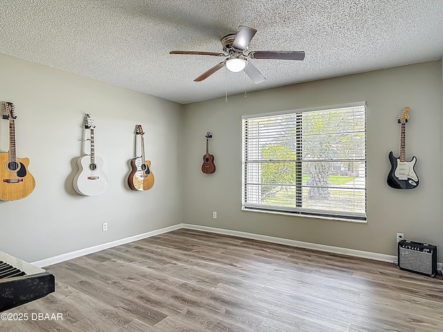 7 Heather Ln, Ormond Beach, FL 32174 - unfurnished room with a ceiling fan, wood finished floors, a textured ceiling, and baseboards