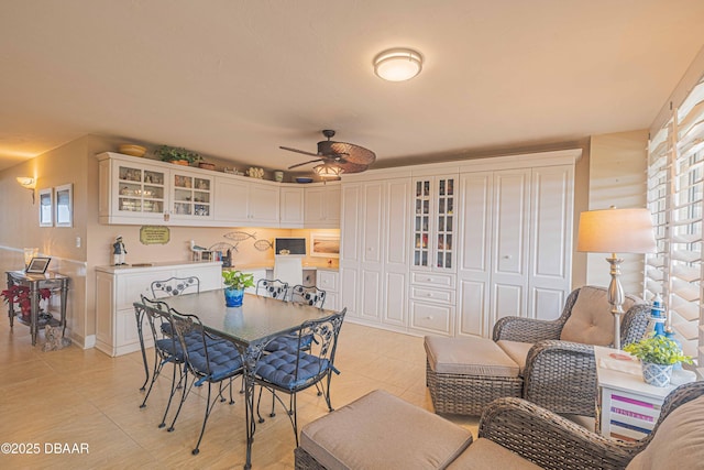 dining room with ceiling fan and light tile patterned floors