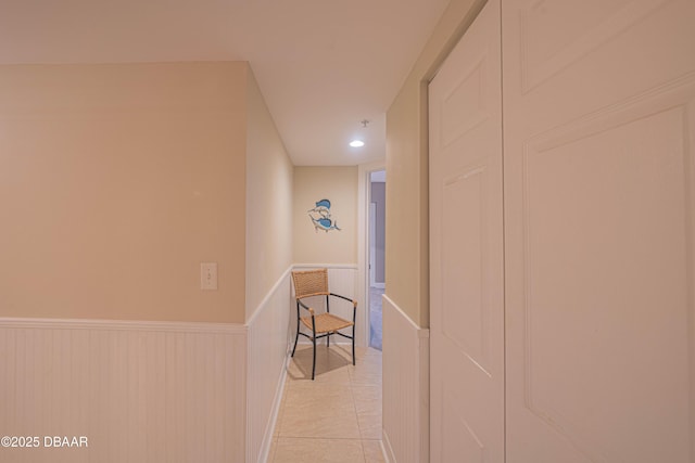 corridor featuring light tile patterned floors