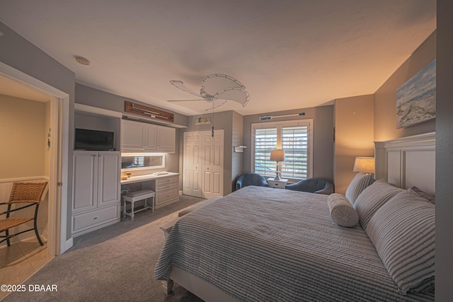 carpeted bedroom featuring ceiling fan