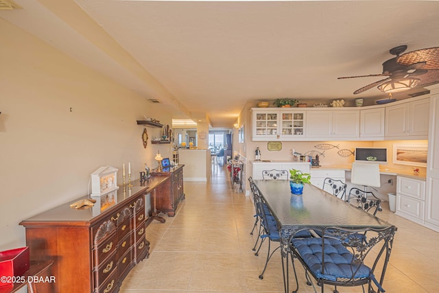 dining room featuring ceiling fan and light tile patterned floors