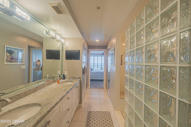 bathroom with vanity and tile patterned flooring