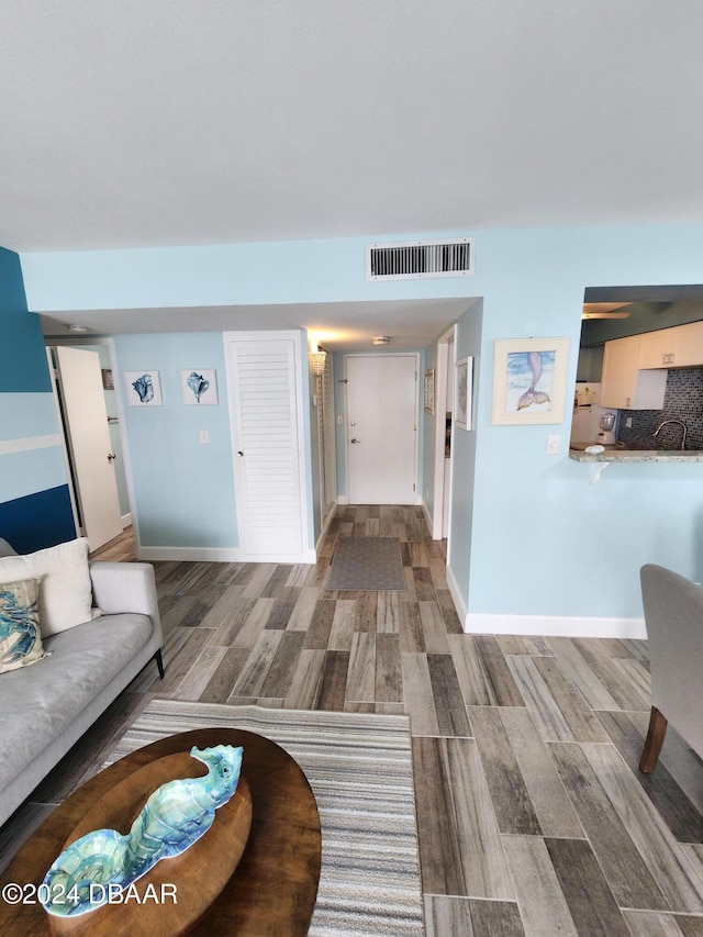 2800 N Atlantic Ave Unit 810, Daytona Beach, FL 32118 - living area featuring wood finished floors and baseboards