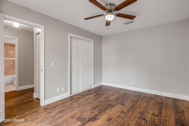 3656 Jackson St Unit 11, Port Orange, FL 32129 - unfurnished bedroom featuring baseboards, visible vents, wood finished floors, and a closet