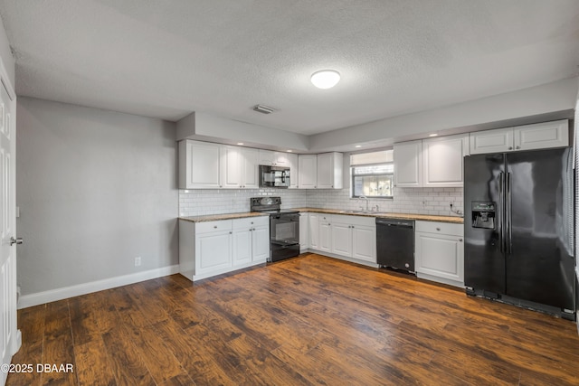 3656 Jackson St Unit 11, Port Orange, FL 32129 - kitchen featuring black appliances, visible vents, baseboards, and tasteful backsplash