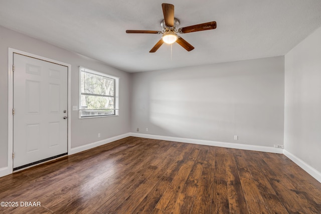 3656 Jackson St Unit 11, Port Orange, FL 32129 - empty room featuring dark wood finished floors, a ceiling fan, and baseboards