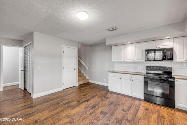 3656 Jackson St Unit 11, Port Orange, FL 32129 - kitchen with black appliances, decorative backsplash, white cabinets, and baseboards