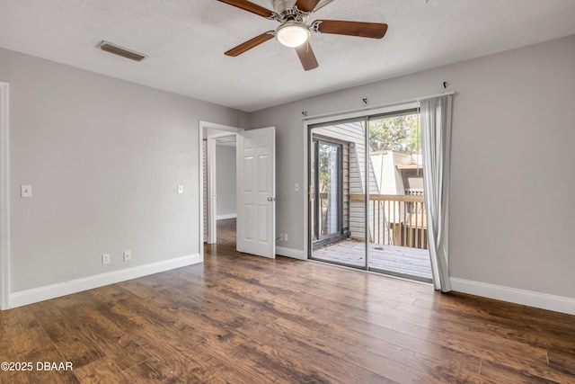 3656 Jackson St Unit 11, Port Orange, FL 32129 - unfurnished bedroom featuring access to exterior, visible vents, wood finished floors, and baseboards