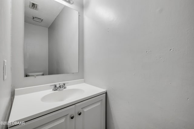 3656 Jackson St Unit 11, Port Orange, FL 32129 - bathroom featuring visible vents and vanity