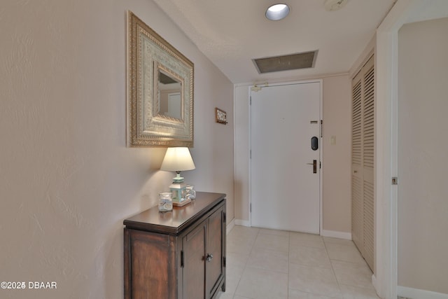 3051 S Atlantic Ave Unit 1806, Daytona Beach Shores, FL 32118 - corridor with baseboards and light tile patterned floors