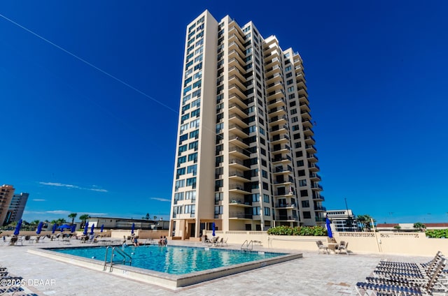 3051 S Atlantic Ave Unit 1806, Daytona Beach Shores, FL 32118 - community pool featuring a patio