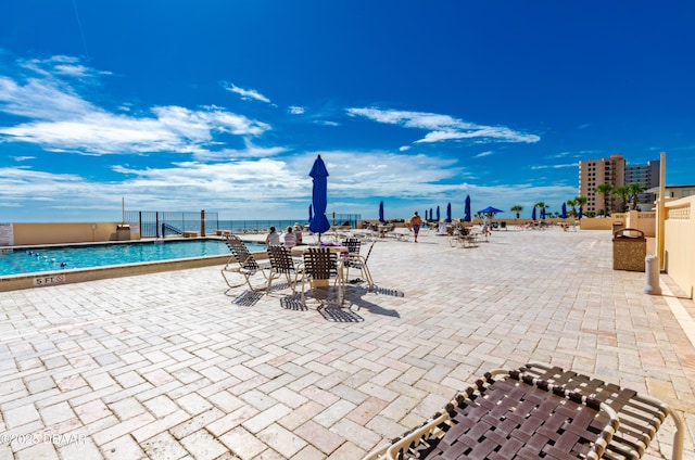 3051 S Atlantic Ave Unit 1806, Daytona Beach Shores, FL 32118 - community pool featuring a patio
