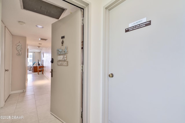 3051 S Atlantic Ave Unit 1806, Daytona Beach Shores, FL 32118 - hallway featuring light tile patterned floors and baseboards