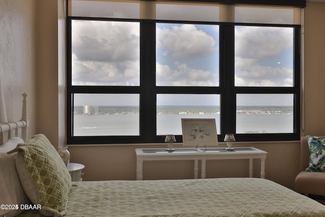 3051 S Atlantic Ave Unit 1806, Daytona Beach Shores, FL 32118 - bedroom featuring multiple windows and a water view