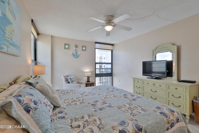 3051 S Atlantic Ave Unit 1806, Daytona Beach Shores, FL 32118 - bedroom with a textured ceiling and ceiling fan