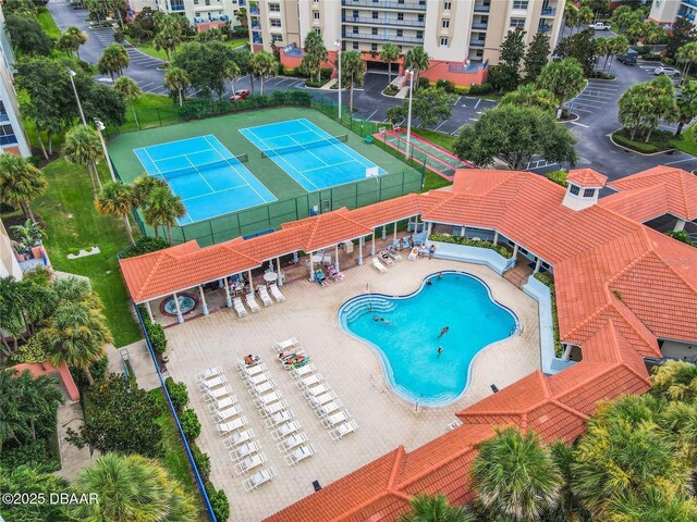 5300 S Atlantic Ave Unit 9-403, New Smyrna Beach, FL 32169 - view of swimming pool with a tennis court and fence
