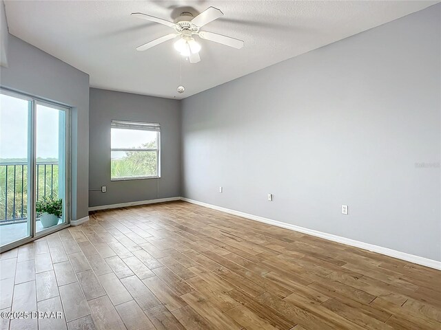 5300 S Atlantic Ave Unit 9-403, New Smyrna Beach, FL 32169 - spare room with ceiling fan, baseboards, and wood finished floors