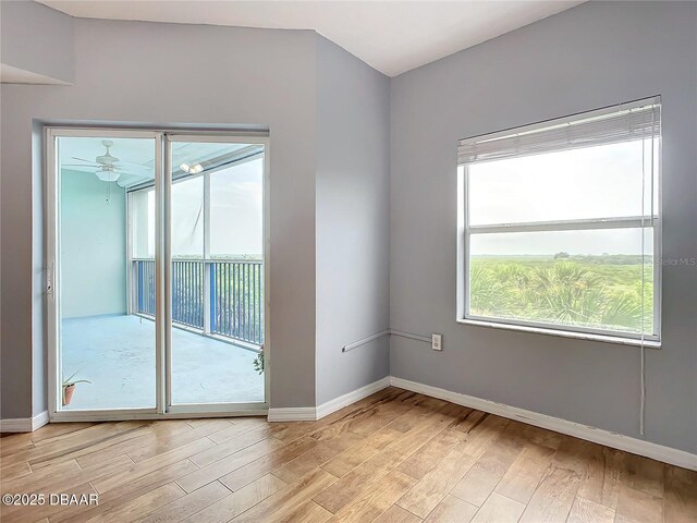 5300 S Atlantic Ave Unit 9-403, New Smyrna Beach, FL 32169 - unfurnished room featuring baseboards, light wood-type flooring, and ceiling fan