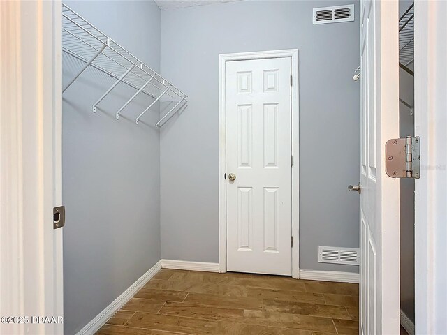 5300 S Atlantic Ave Unit 9-403, New Smyrna Beach, FL 32169 - walk in closet featuring wood finished floors and visible vents