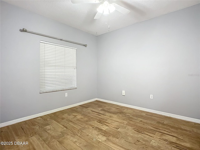 5300 S Atlantic Ave Unit 9-403, New Smyrna Beach, FL 32169 - spare room with light wood-style floors, baseboards, and ceiling fan