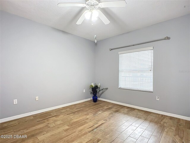 5300 S Atlantic Ave Unit 9-403, New Smyrna Beach, FL 32169 - spare room with light wood-style floors, ceiling fan, and baseboards