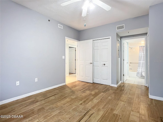 5300 S Atlantic Ave Unit 9-403, New Smyrna Beach, FL 32169 - unfurnished bedroom with a closet, visible vents, baseboards, and wood finished floors