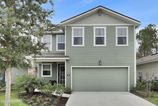 traditional-style home with a garage and driveway