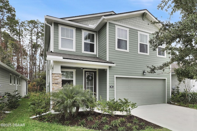 traditional home featuring an attached garage and driveway