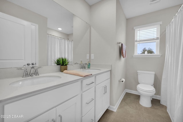 bathroom featuring toilet and vanity