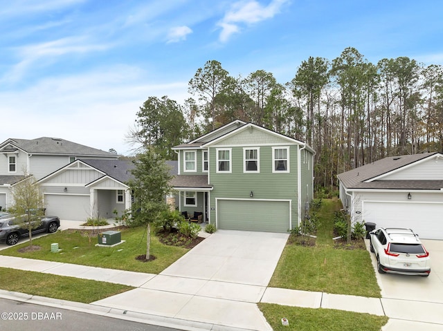 view of front property with a garage and a front yard