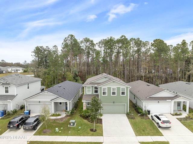 view of front of property with a front lawn and a garage