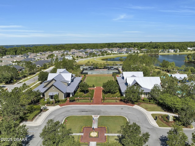 birds eye view of property with a water view