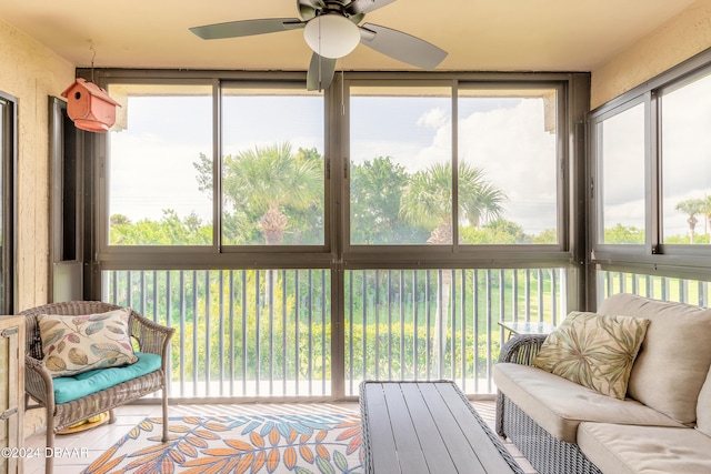 sunroom with ceiling fan and plenty of natural light