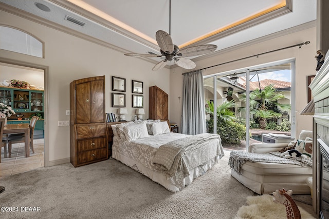 carpeted bedroom featuring ceiling fan, crown molding, and access to outside