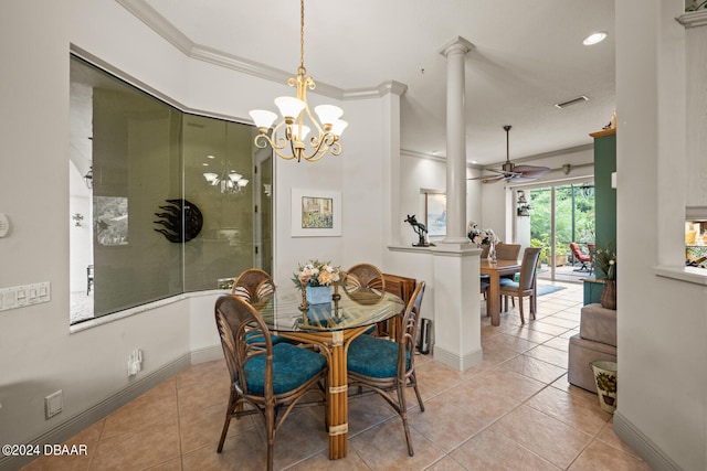 dining area with ceiling fan with notable chandelier, light tile patterned floors, ornate columns, and crown molding