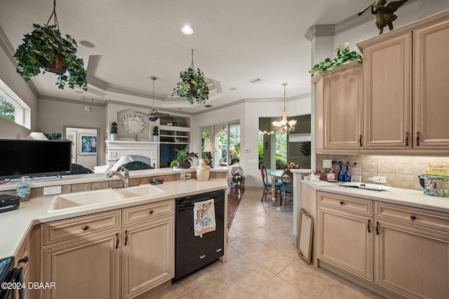 kitchen featuring dishwasher, light brown cabinets, a healthy amount of sunlight, and pendant lighting