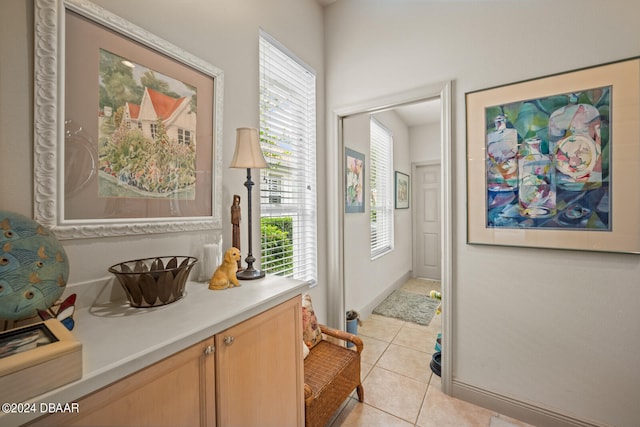 entryway featuring light tile patterned flooring