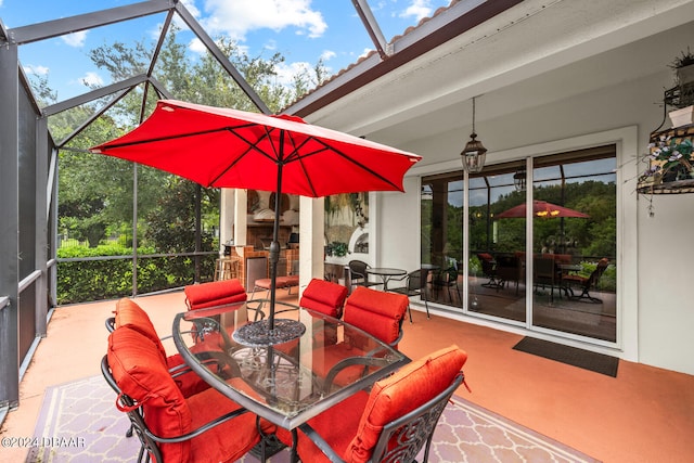 view of patio featuring glass enclosure