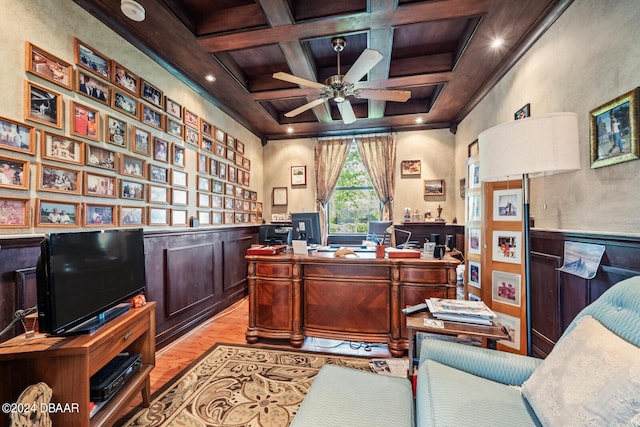 office space featuring ornamental molding, beam ceiling, light wood-type flooring, and coffered ceiling