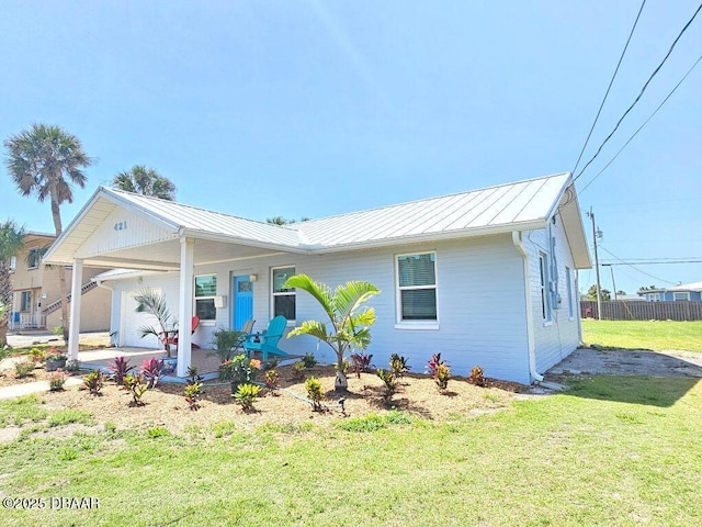 421 University Blvd, Daytona Beach, FL 32118 - view of front of home with a standing seam roof and metal roof