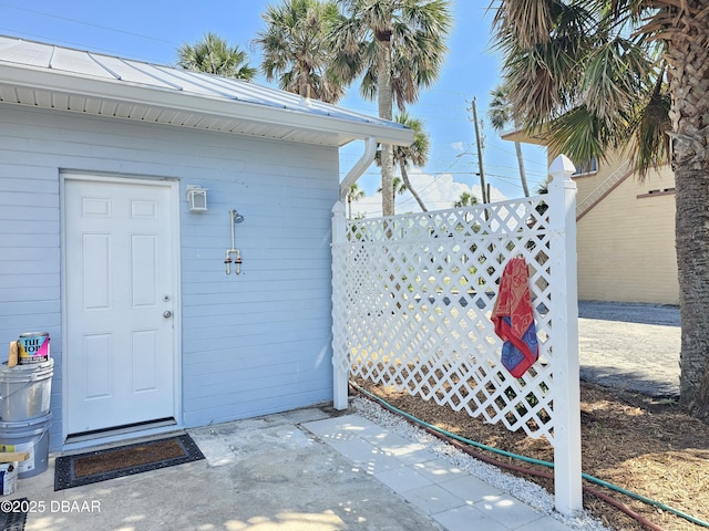 421 University Blvd, Daytona Beach, FL 32118 - view of exterior entry with a standing seam roof
