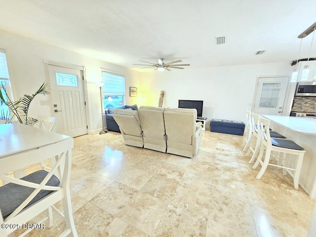 421 University Blvd, Daytona Beach, FL 32118 - living area featuring a ceiling fan