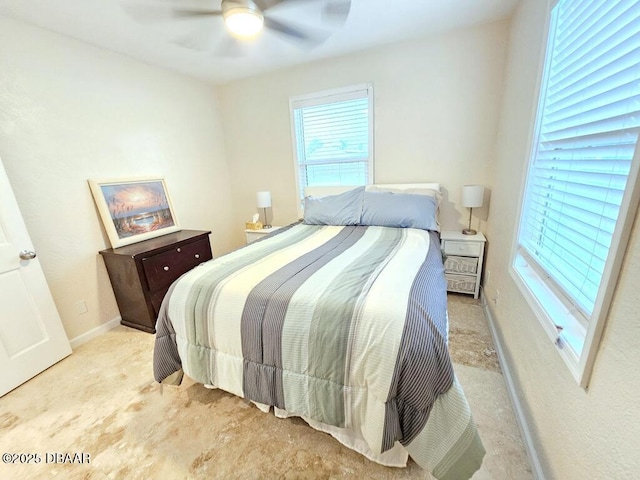 421 University Blvd, Daytona Beach, FL 32118 - bedroom with a ceiling fan, light colored carpet, and baseboards