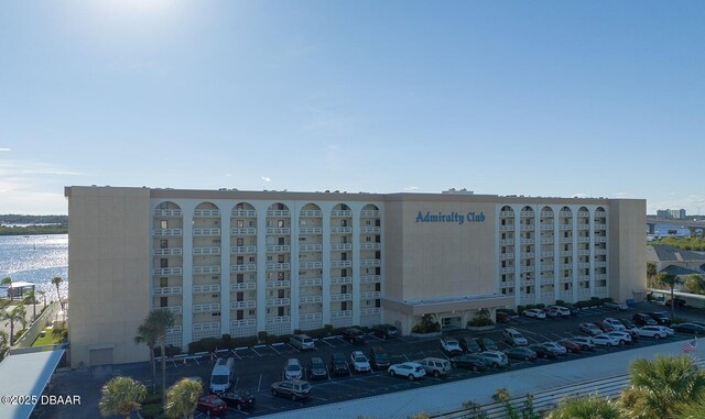 3606 S Peninsula Dr Unit 406, Port Orange, FL 32127 - view of property featuring uncovered parking and a water view