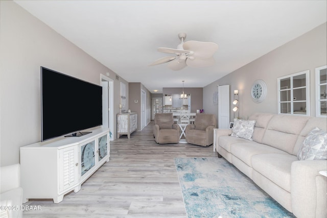 3606 S Peninsula Dr Unit 406, Port Orange, FL 32127 - living area featuring ceiling fan and light wood-type flooring